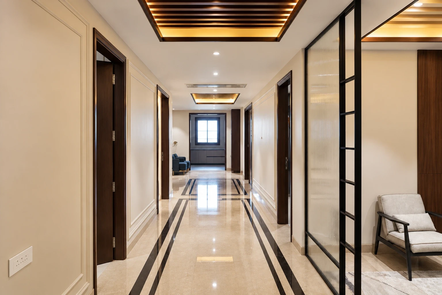 Palam View hallway with polished marble flooring, dark wood door frames and illuminated ceiling slats
